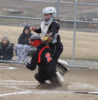 Tasha Gimmeson was able to slide under the tag attempt and score against Troy on this play.