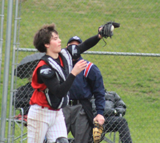 Catcher Terran Peery catches a foul pop up against Troy.
