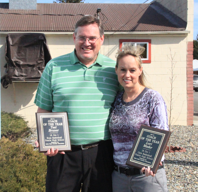 Clark Bruno slides safely into third as the throw gets away from the Troy fielder.
