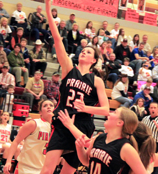 Hanna Ross is about to catch the ball for an out at first against Troy after pitcher Leah Holthaus, foreground, had fielded a comebacker.
