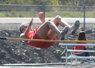 Brandi Gehring clears the bar in the high jump.