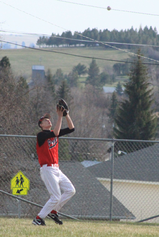 Jake Bruner settles under the ball in right field to make a catch.