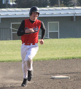 Calvin Hinkelman is in his home run trot after a 3-run homer against C.V.