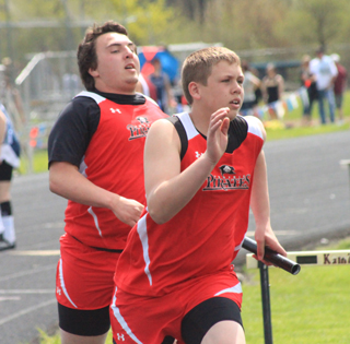 Dakota Wilson has just handed off to Ryan Glimp in the 4x200 relay.