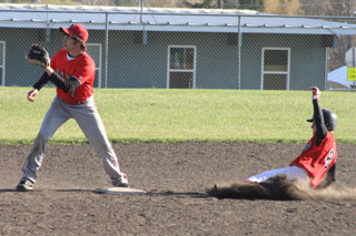 Devin Bruegeman slides safely into second base against C.V.