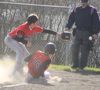 John Mager slides home safely after a wild pitch in the C.V. game.