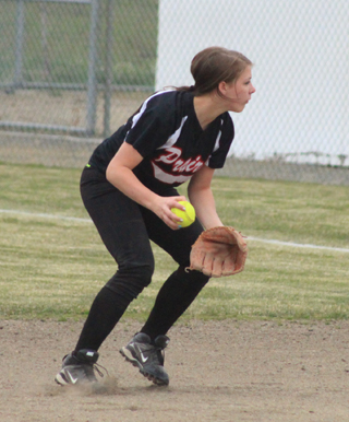 Second baseman Tasha Gimmeson is ready to throw out a runner at first after fielding a grounder.