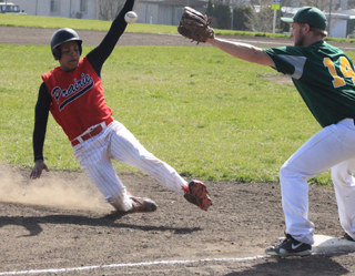 Tyler Hankerson slides into third against Potlatch. He managed to slide in under the tag and was called safe.