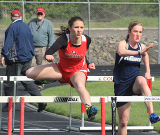 Mykaela McWilliams leads over the 2nd hurdle and went on to win the 100 hurdles race. She also won the 300 hurdles at the White Pine Meet Monday.
