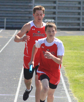 Isaiah Shears has just handed off to Lucas Wemhoff in the 4x200relay at the Area Best Meet.