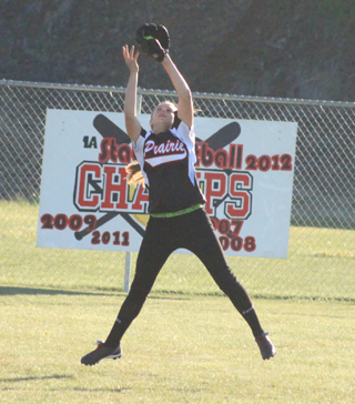 Kylie Tidwell has to jump to make the catch on a ball hit to centerfield in the Genesee game.