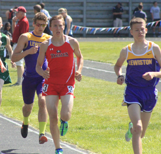 Peter Spencer trails a Lewiston runner in the 1600 where he wound up placing 3rd.