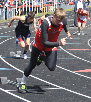 Lucas Arnzen bolts from the blocks at the start of the 400 meter dash. He qualified for state in the 100, 200, 400 and medley relay.