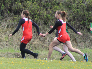 Mykaela McWilliams hands off to Shayla VonBargen in the 4x100 relay.