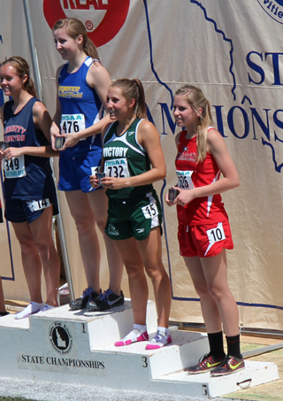 Chaye Uptmor, right, is on the medal stand after finishing 5th in the 800.