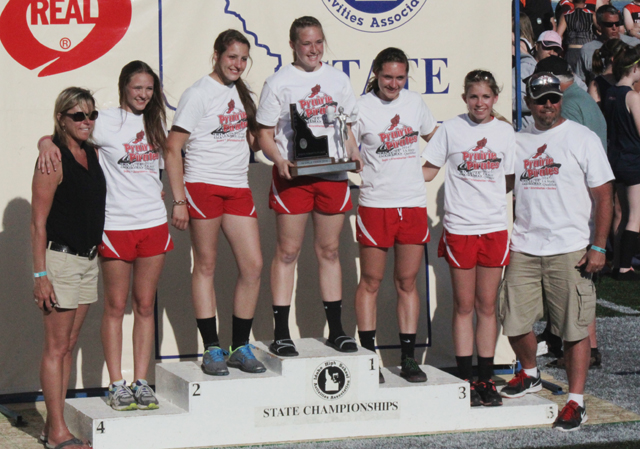 The girls team with their fourth place team trophy. From left are assistant coach Becky Higgins, Mykaela McWilliams, Shayla VonBargen, Keely Schmidt, Krystin Uhlenkott, Chaye Uptmor and head coach Ryan Hasselstrom. Not pictured are Heidi Holubetz and Brandi Gehring.