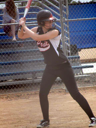 Holli Uhlorn gets ready to swing the bat at the State Tournament. Photo by Kathy Seubert.