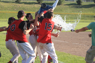 Head baseball coach Kyle Westhoff got an ice water shower from the team as he was being interviewed by KLEW-TV after the championship game.