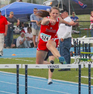 Mykaela McWilliams in the 100 hurdles prelims at state. She took second in the finals and broke a school record in the 300 hurdles despite finishing 4th.