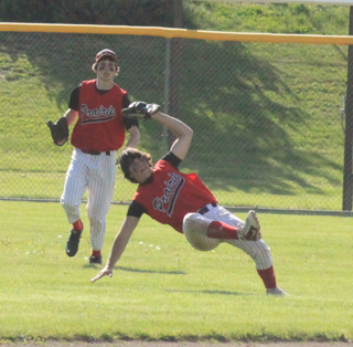 2nd baseman Terran Peery managed to hang on for the catch on this pop-up into short right field in the winner-take-all game against Genesee. Backing up the play is John Mager.