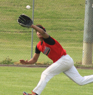 Tyler Hankerson is about to make a great running catch along the left field foul line against Horseshoe Bend. All 3 outfielders made great plays in the game, John Mager in right and Jake Bruner in center.