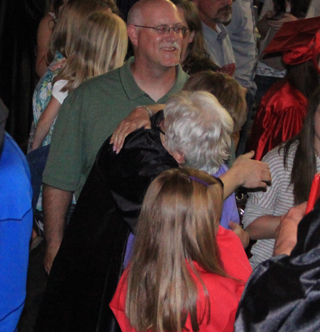 Jared Higgins gets a hug from Marianne Wren.