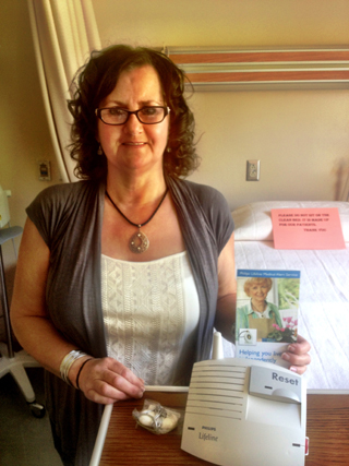 Lana Lentz, Lifeline Coordinator showing off one of the Lifeline units. Photo provided by Cheri Holthaus.