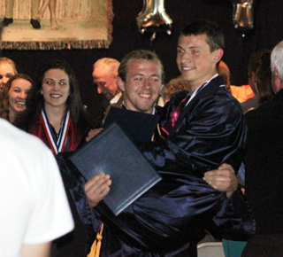 Matthew Schwartz carries Michael Waters during the recessional.