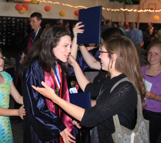 Megan Rehder and her cousin Lynn Rehder are about to hug.