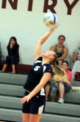 Summits Ally Sonnen reaches for a spike at Kamiah.