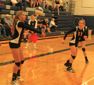 Chaye Uptmor makes a pass at the Grangeville Jamboree. #11 is Krystin Uhlenkott.