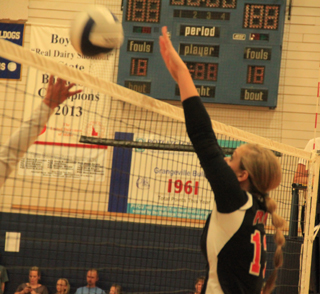 Prairies Holli Uhlorn blocks a Grangeville hitter at the Jamboree Tuesday, Aug. 26.