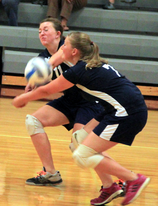 Summits Kaitlyn Stubbers and Lucy Osborne nearly collide going after a Kamiah serve in the match at Kamiah last Thursday.