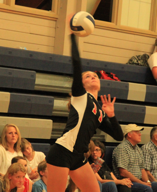 Krystin Uhlenkott tries a jump serve at the volleyball Jamboree Tuesday, Aug. 26 at Grangeville