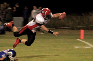 Calvin Hinkelman leaps for the goal line coming down with the ball just across the stripe for a touchdown.