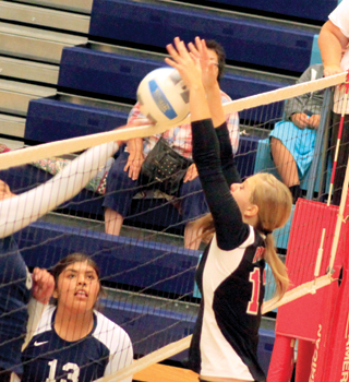 Holli Uhlorn stuffs a Lapwai spike attempt.