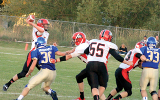 Quarterback Jake Bruner had plenty of time to get off a pass thanks to the line and backs blocking. #55 is Bobby Hood with Calvin Hinkelman at right.