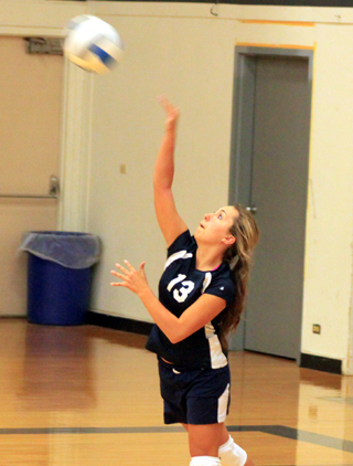 Summits Rachel Waters serves against Deary.