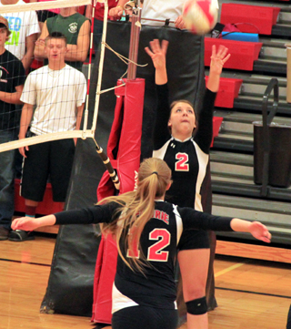 Prairies Natasha Gimmeson makes a set while Kayla Schumacher is getting ready to go up for the kill