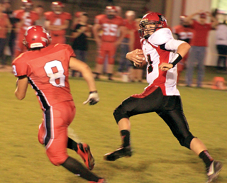 Jake Bruner evades a tackler on his way to a 50-yard touchdown.
