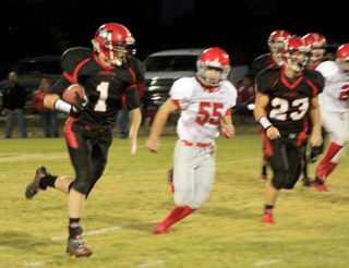 Lucas Arnzen gets around the right side for the first of his 3 touchdowns against C.V. #23 is Calvin Hinkelman.