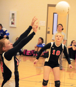 Sarah Seubert makes a pass as Kellie Heitman watches at the Border Battle against St. John Endicott.