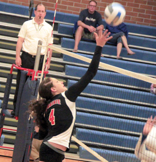 Shayla VonBargen tips the ball past the blockers at the Genesee match.