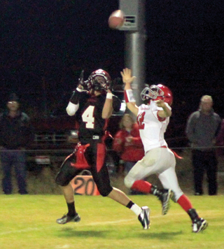 Isaiah Shears is about to catch a long pass from Rhett Schlader that wound up going for a touchdown as he fought off the tackle attempt of the C.V. defender shown.
