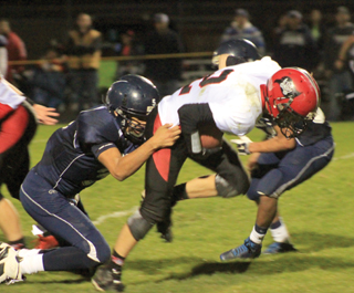Mason Dalgliesh tries to power through a tackle attempt.