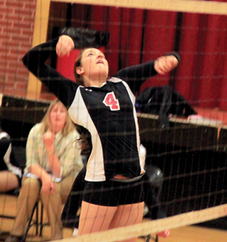 Shayla VonBargen winds up for a spike against Troy.