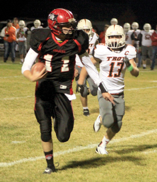 Jake Bruner outruns Troy's Kellen Hoskins for a touchdown.