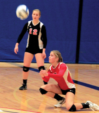Chaye Uptmor makes a pass against C.V. Also shown is Kayla Schumacher.