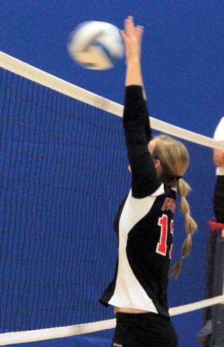 Holli Uhlorn makes a block against C.V.