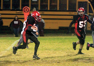 Brandon Higgins had an 18 yard gain late in the game. At right is Bobby Hood.